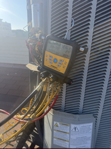 HVAC technician diagnosing AC running all day but not cooling properly in Carlsbad CA